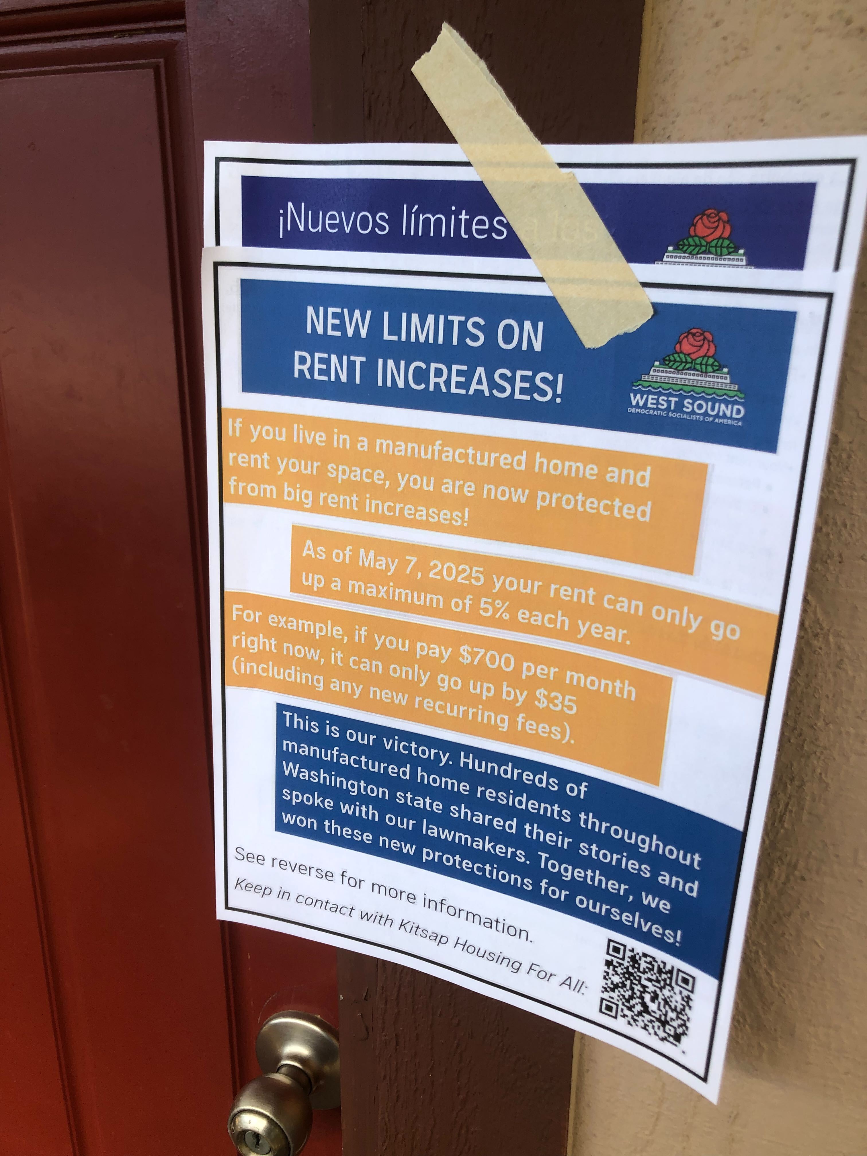 Volunteer holding 'Housing is a Human Right' sign